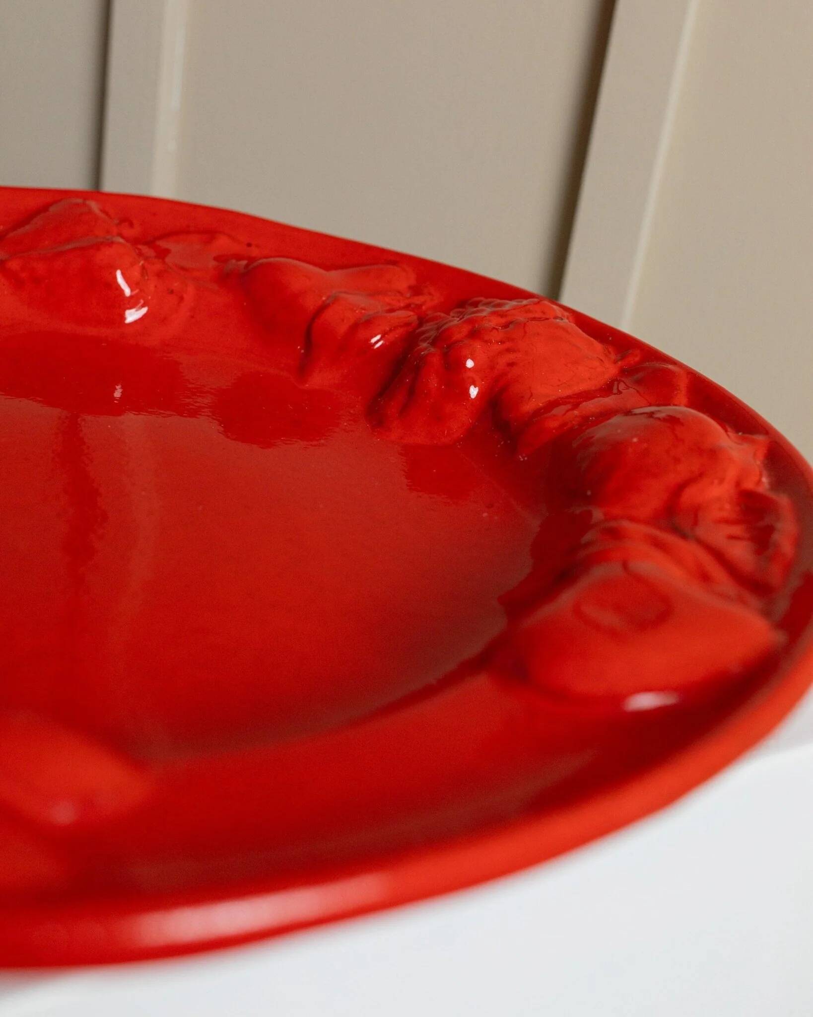 Red glazed ceramic fruit platter with three-dimensional fruit relief, vintage Italy 1980s, Mid-Century design