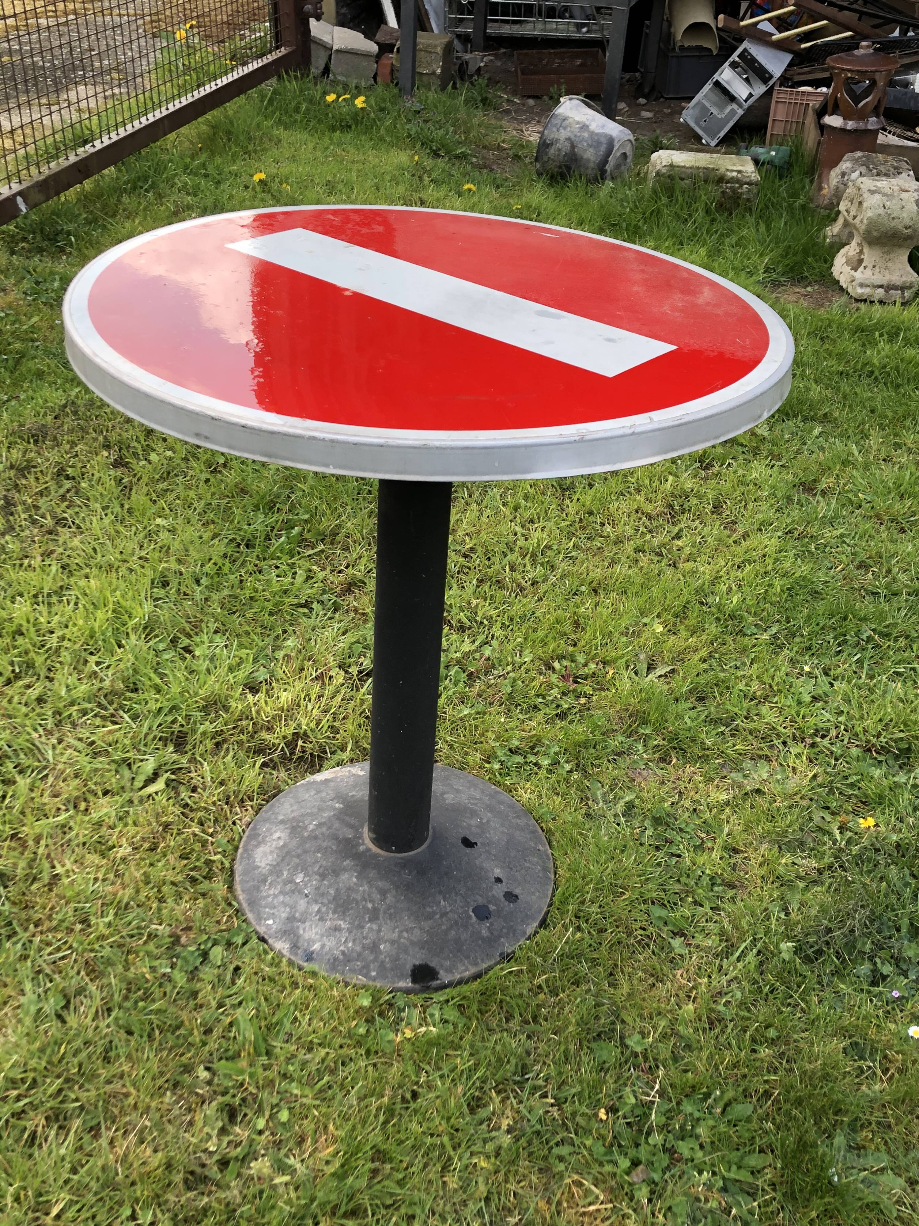 Table of bistro/garden vintage road sign meaning forbidden