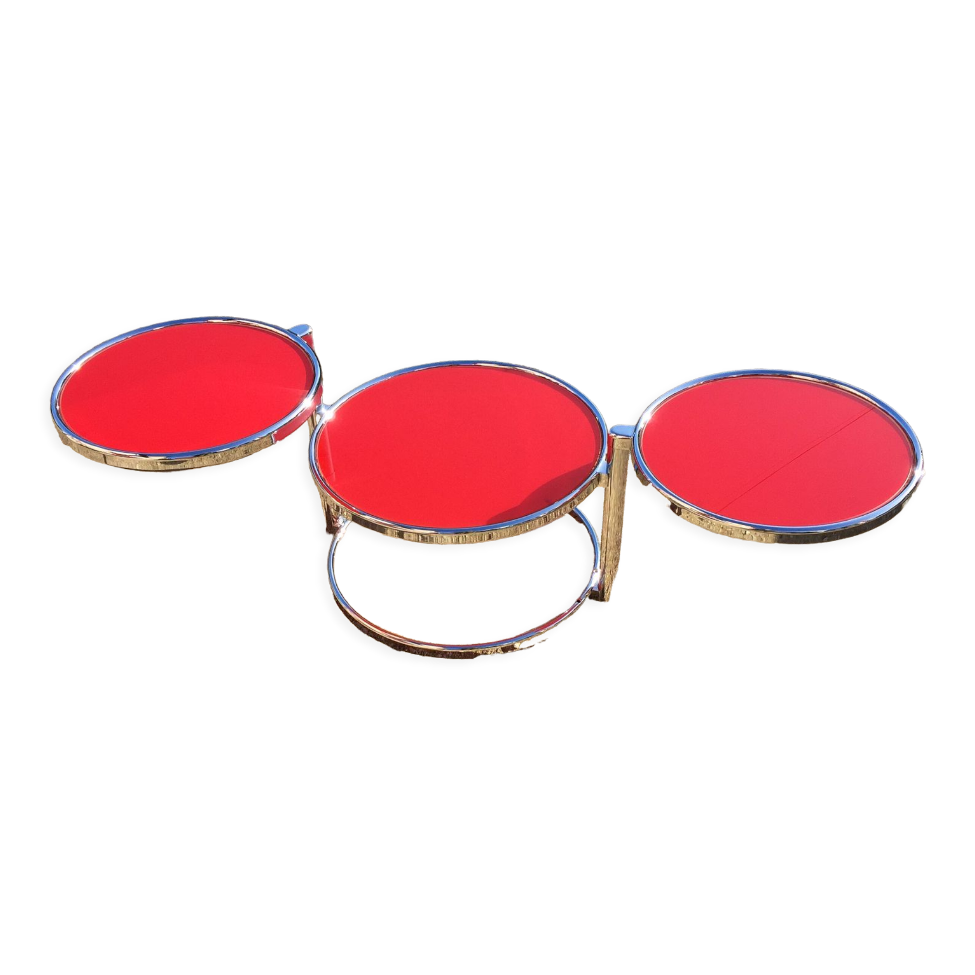 Table basse trois plateaux pivotants en verre rouge et métal chromé