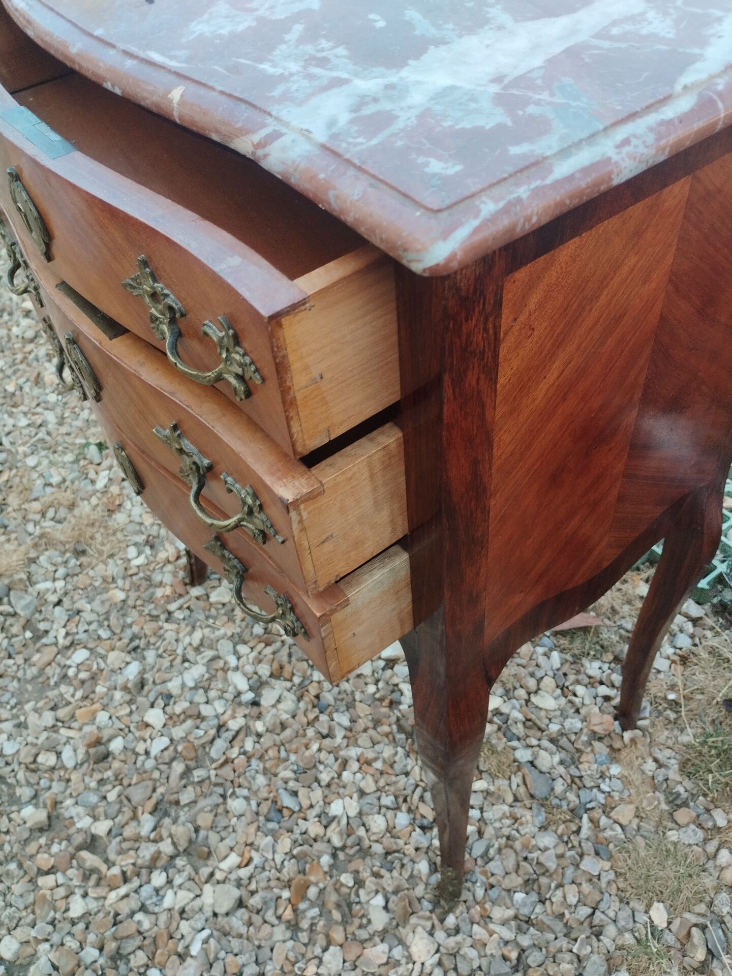 Antique marquetry commode with marble top in Louis XVI style.