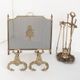 Antique bronze fire screen and fireplace accessories set. Game of seven. France, 1930s