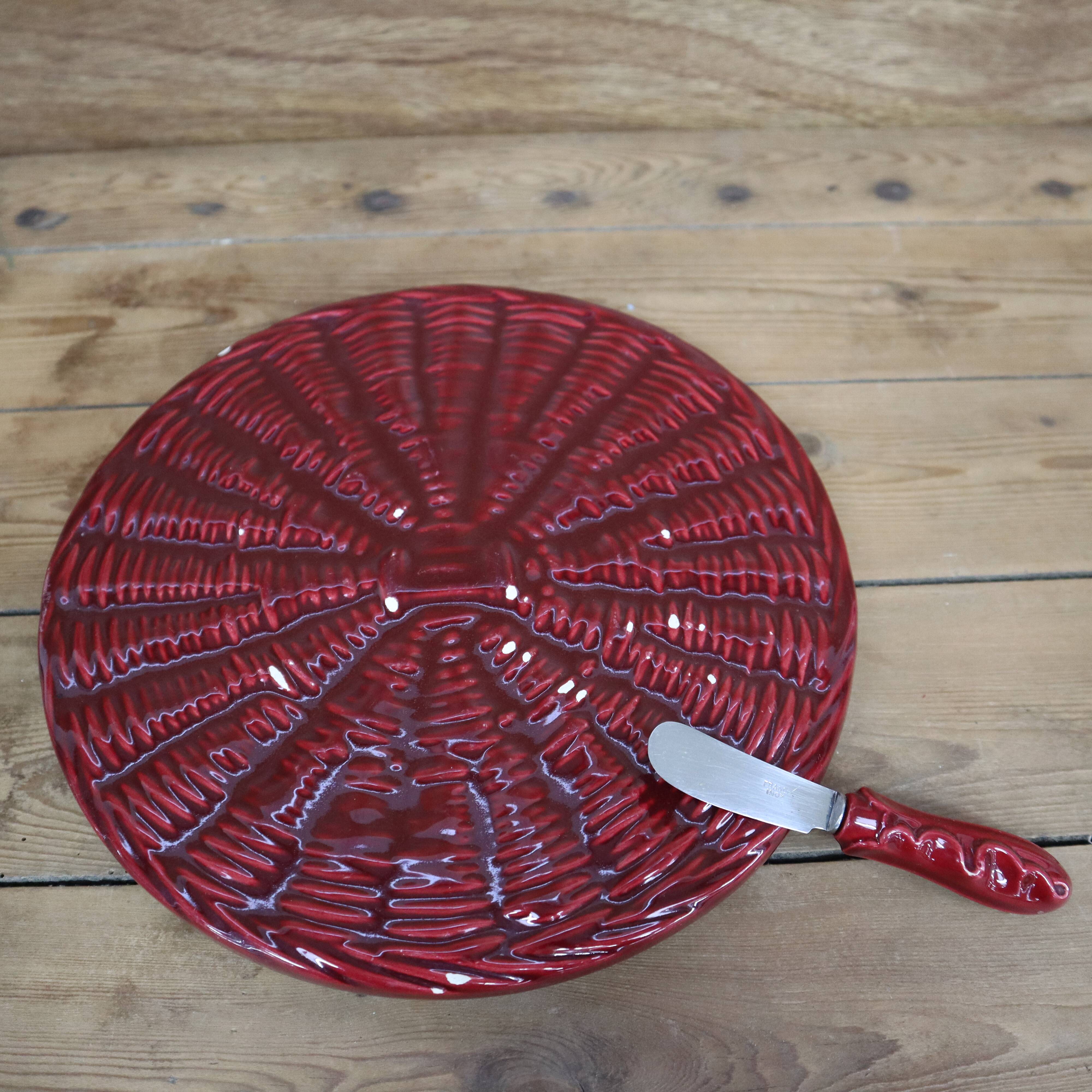 Burgundy slip tray and its small vintage knife from the 50s