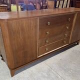 According to André Arbus, a sideboard in a row from the Art Deco period in blonde mahogany.