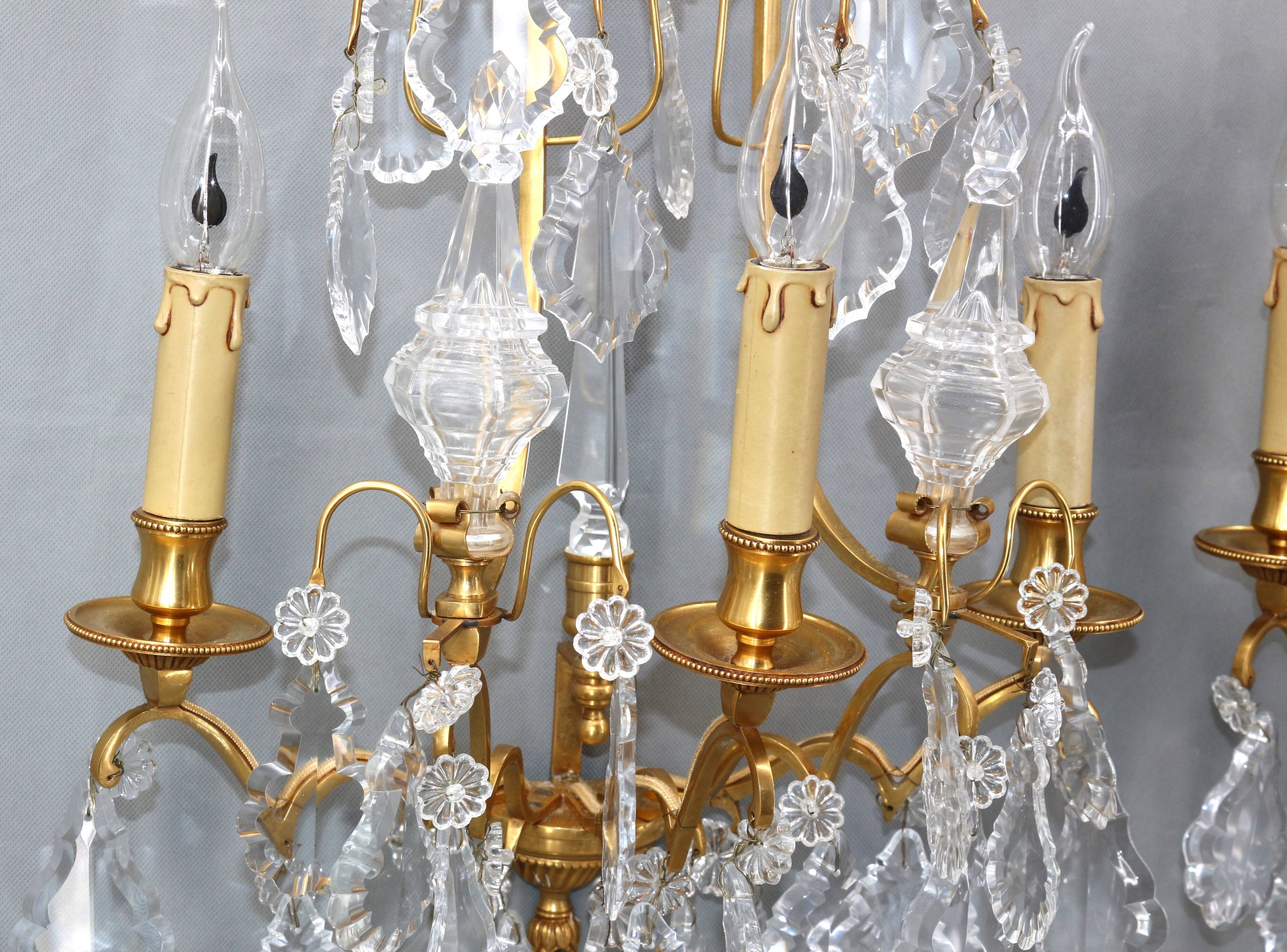 Pair of Louis XVI style gilded bronze & bohemian crystal sconces