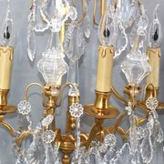 Pair of Louis XVI style gilded bronze & bohemian crystal sconces