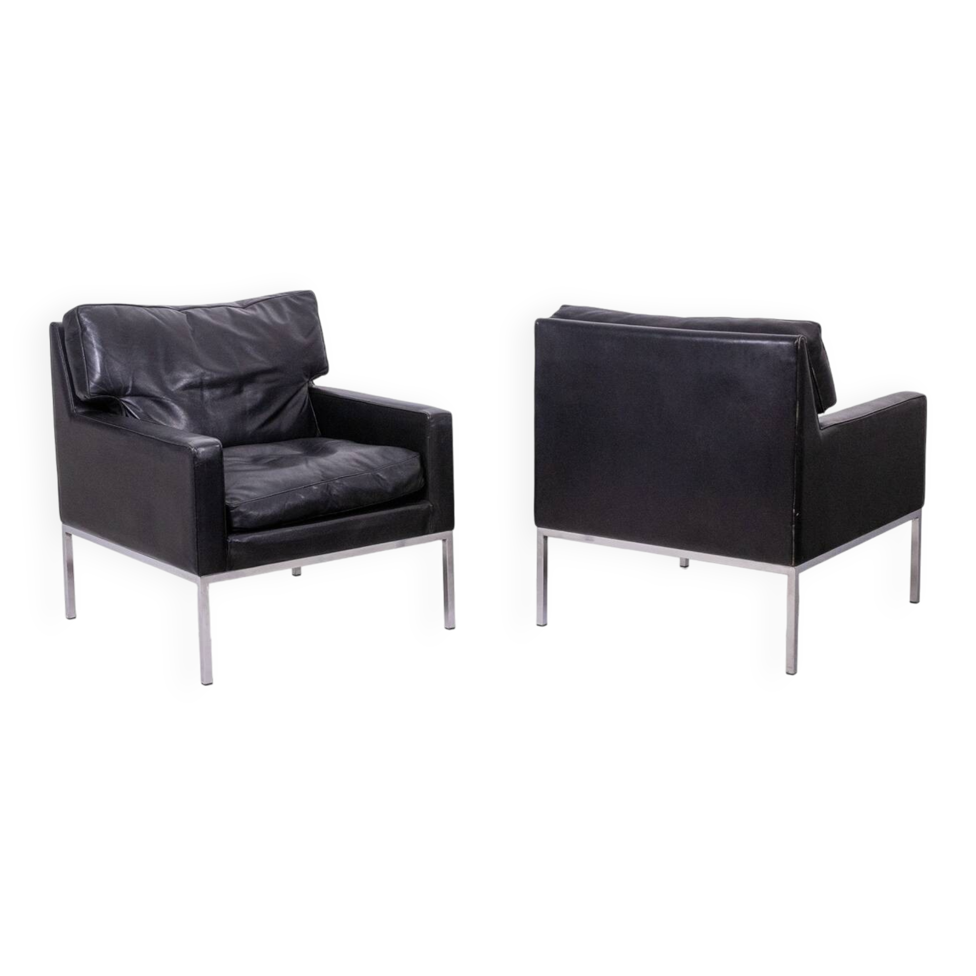 Pair of armchairs in black leather and chrome metal. 1970s.