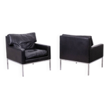 Pair of armchairs in black leather and chrome metal. 1970s.