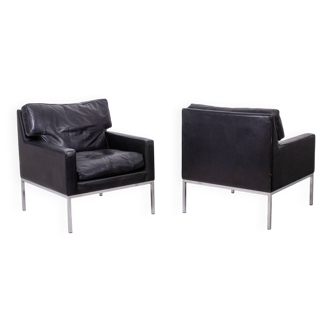 Pair of armchairs in black leather and chrome metal. 1970s.
