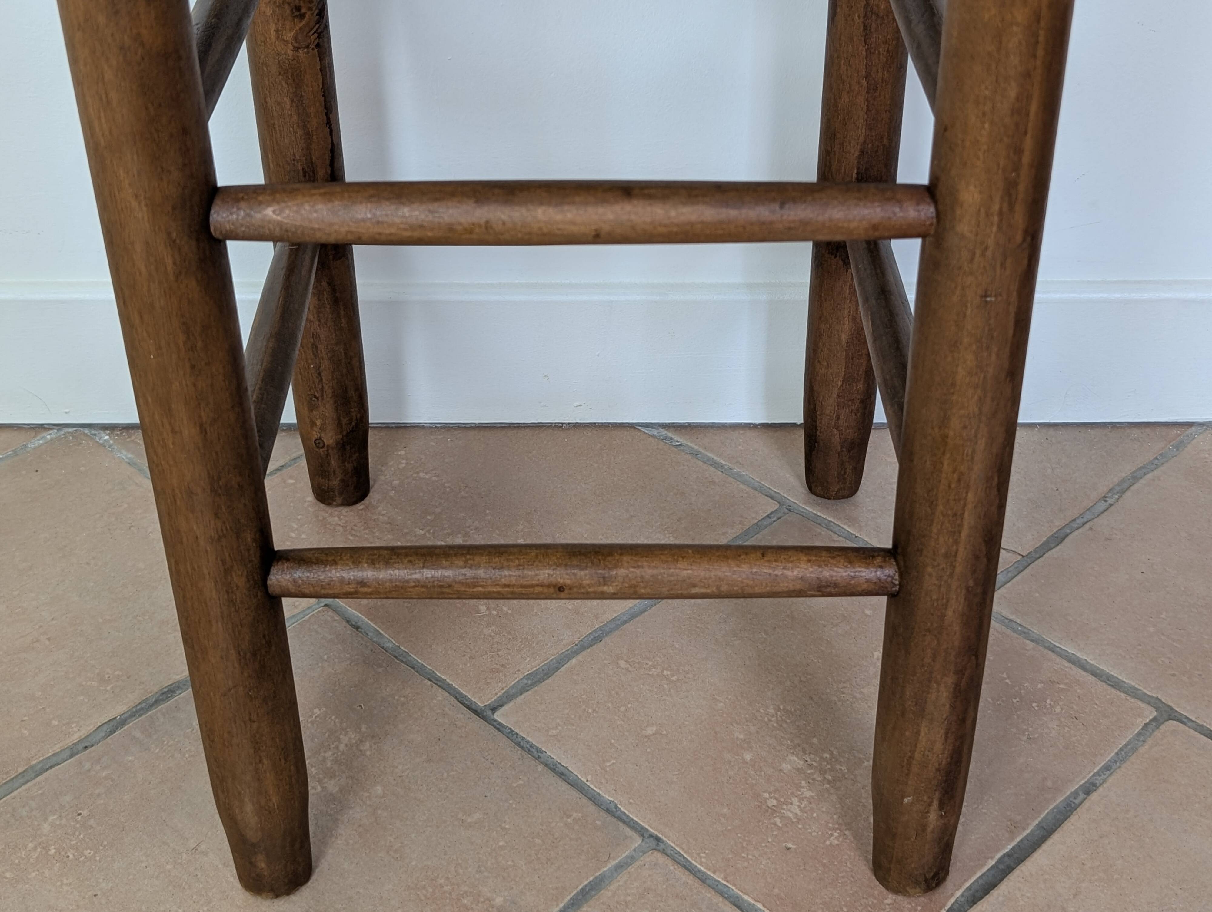 High wooden and straw stools