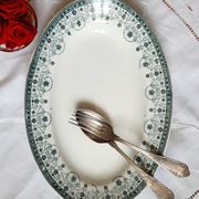 Old flat plates mismatched in iron earth accompanied by a serving dish