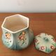 Sugar bowl in slip stamped Saint Clément and numbered 6461. Hand painted.