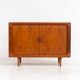 Svend Dyrlund teak sideboard with tambour doors (Denmark, 1960s).