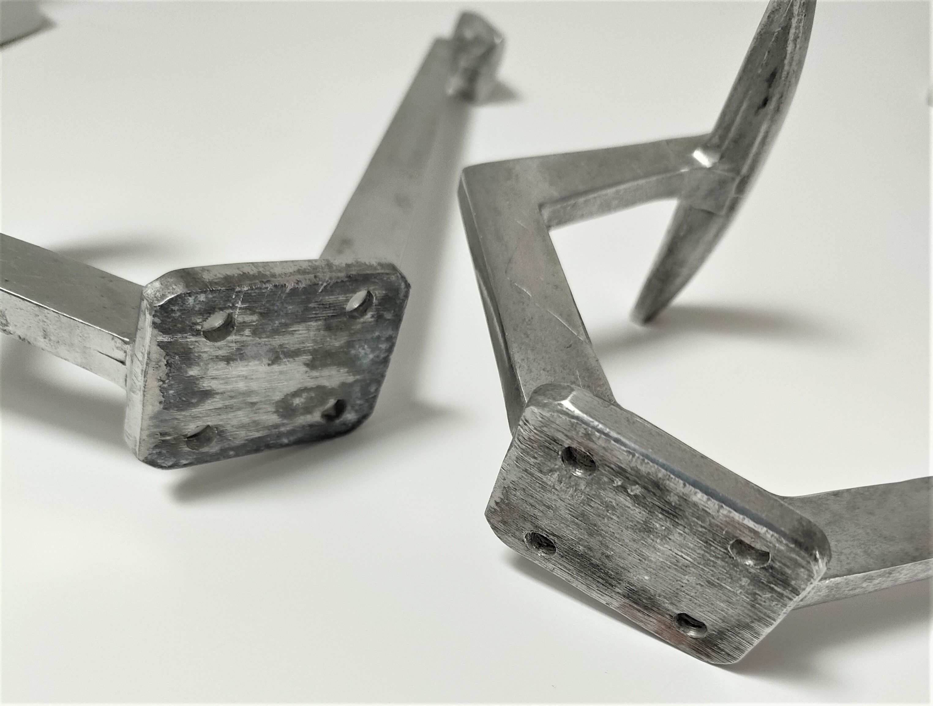 Four porcelain and vintage aluminum hooks