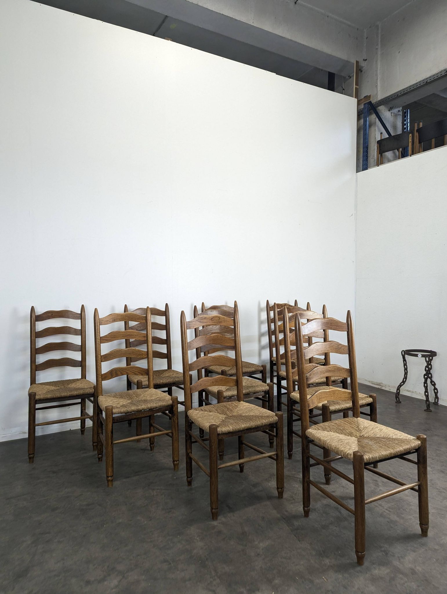 Series of 10 chairs in the style of Charlotte Perriand.