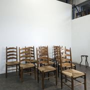 Series of 10 chairs in the style of Charlotte Perriand.