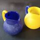 TWO VINTAGE YELLOW AND BLUE GLASS PITCHERS 1990