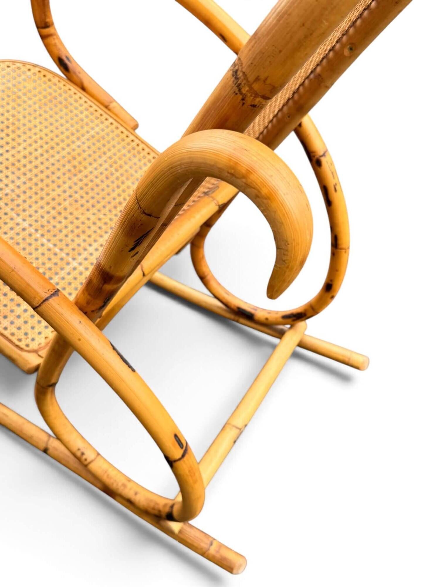 Vintage rocking chair in bamboo and cane