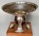 Art deco cut rosewood sphere enclosed in silver metal foot