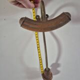 Vintage 1960s wall coat rack in wood and metal.