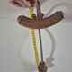 Vintage 1960s wall coat rack in wood and metal.