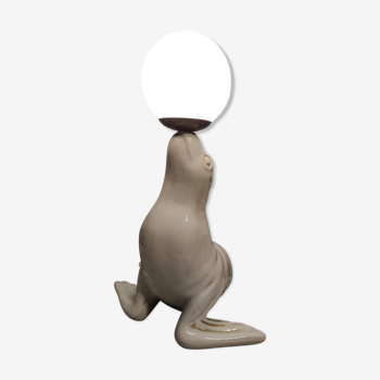 White ceramic sea lion lamp and opaline globe