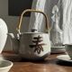 Small Asian stoneware teapot with rattan handle H11 D10