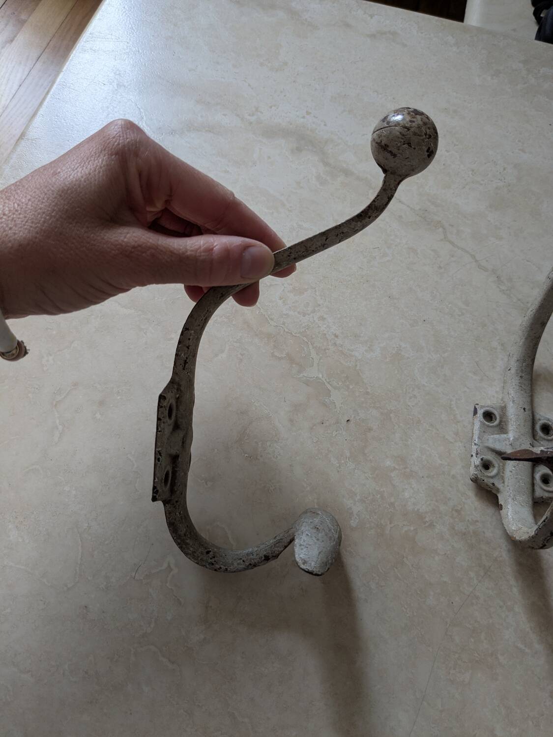 Two vintage coat hooks