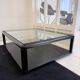 Table basse vintage laquée noire et verre