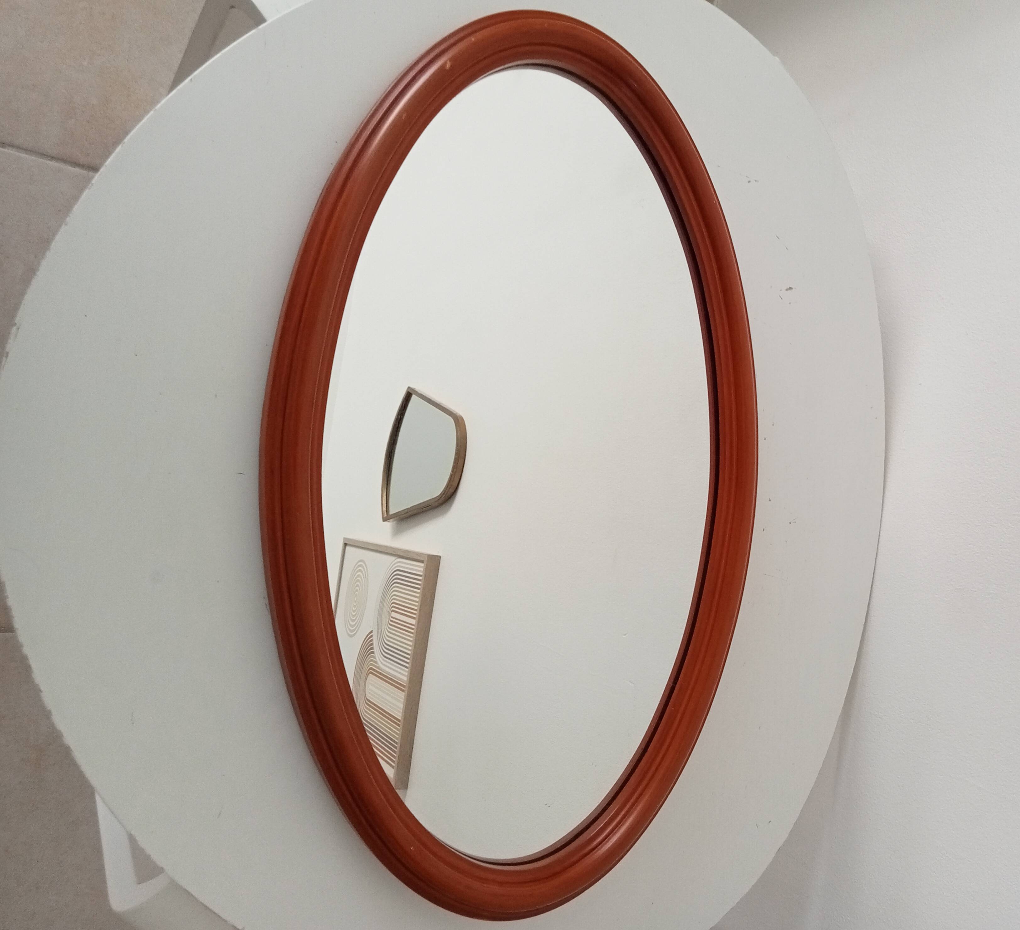 Vintage oval wooden mirror "caramel" from the 1960s.