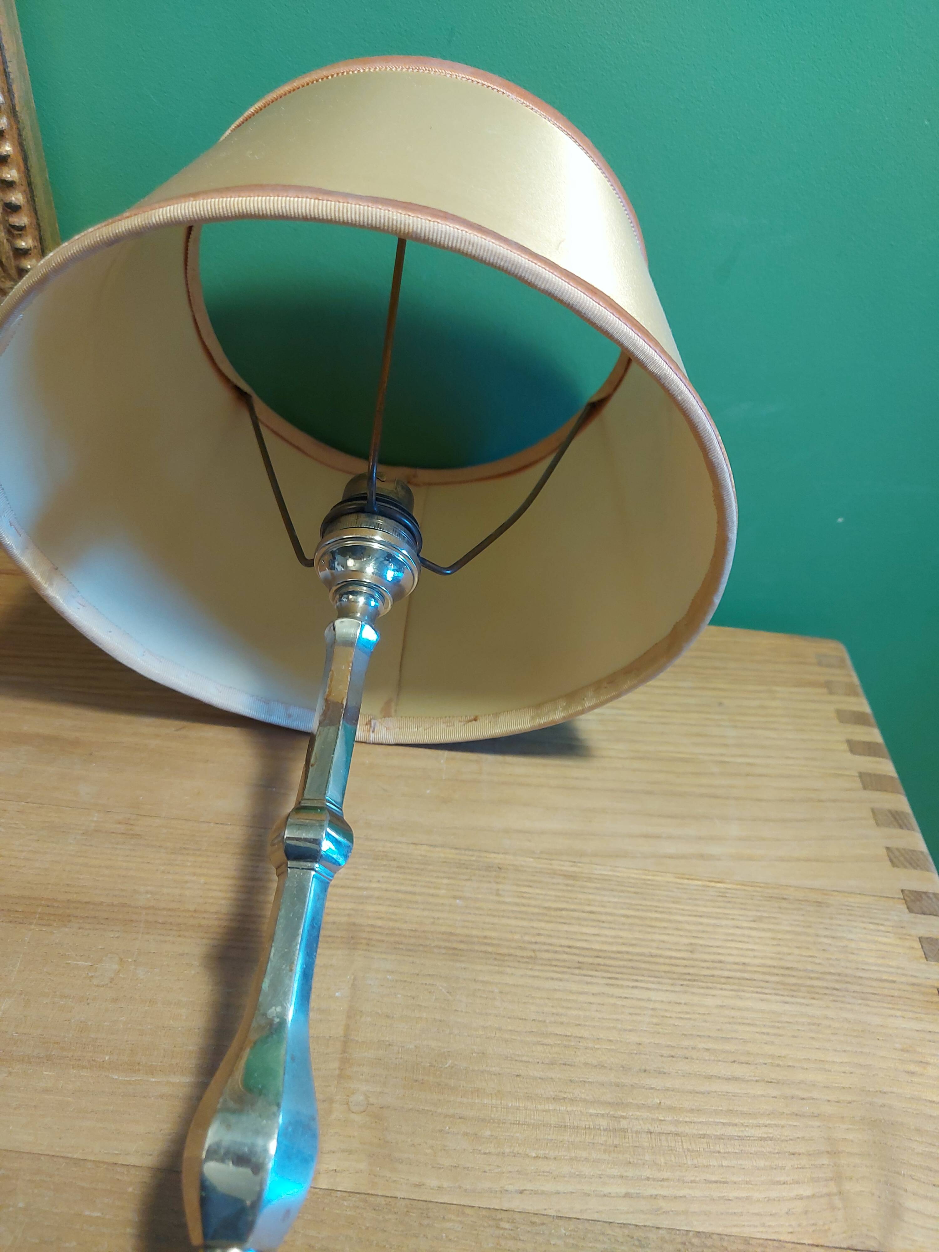 Silver metal lamp with its lampshade