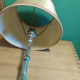 Silver metal lamp with its lampshade