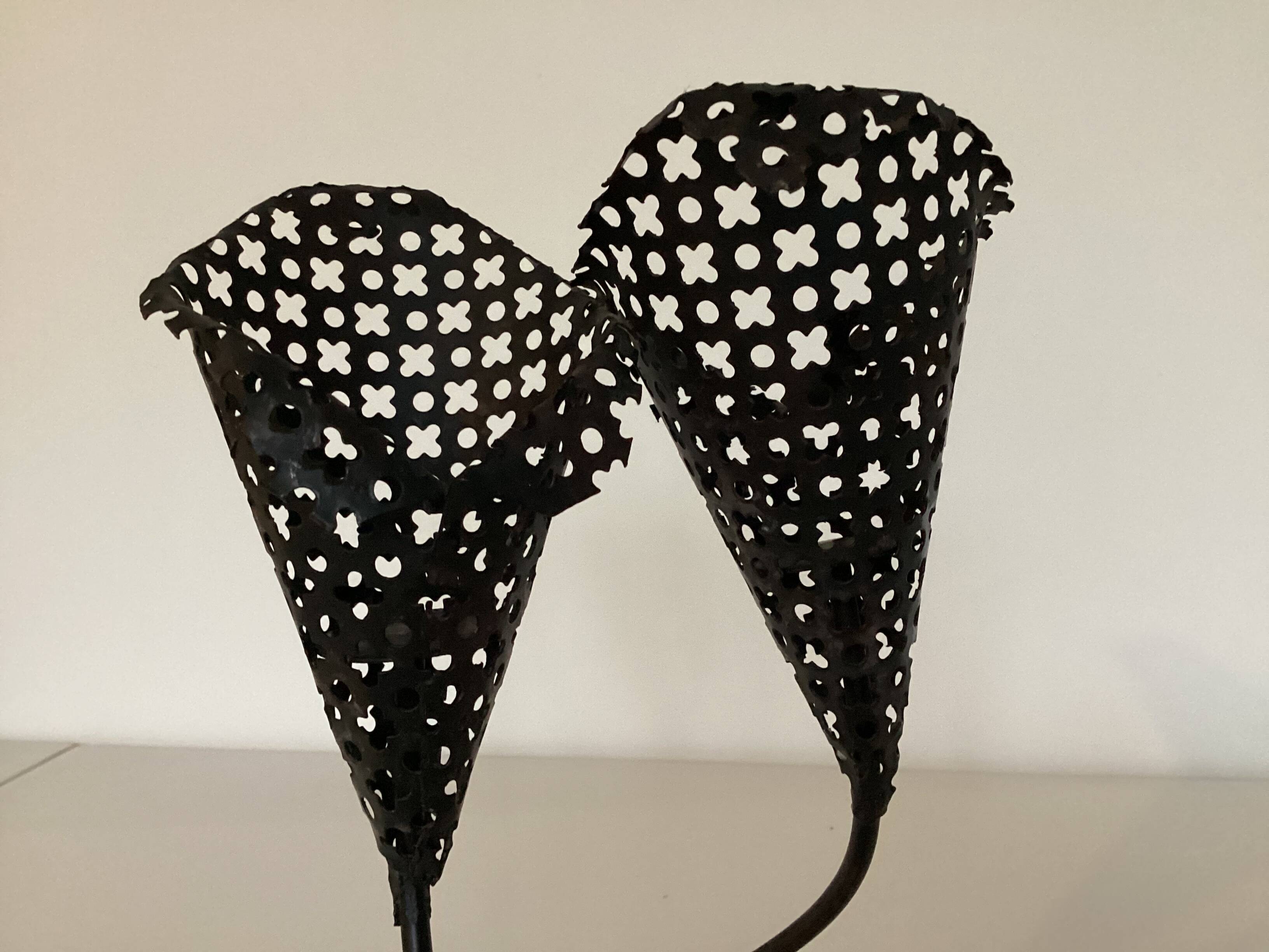 Perforated metal candle holder