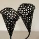 Perforated metal candle holder