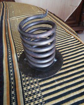 Spiral metal candle holder spring with candle, bronze appearance