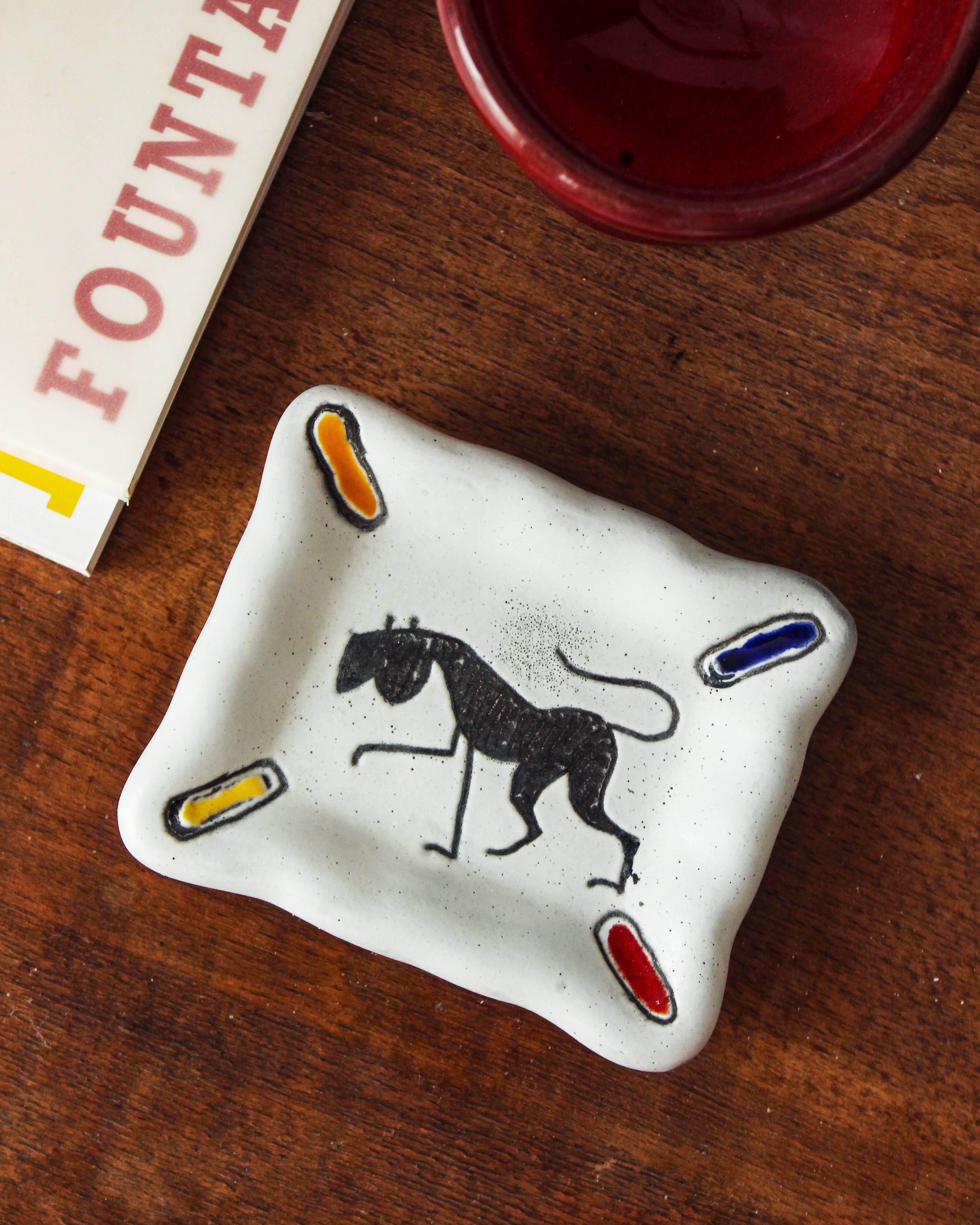 Small white and polychrome glazed ceramic ashtray, 1950s.