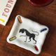 Small white and polychrome glazed ceramic ashtray, 1950s.
