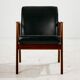 Teak armchair with leather upholstery