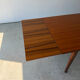 Rectangular extendable table in Scandinavian design made of solid teak.