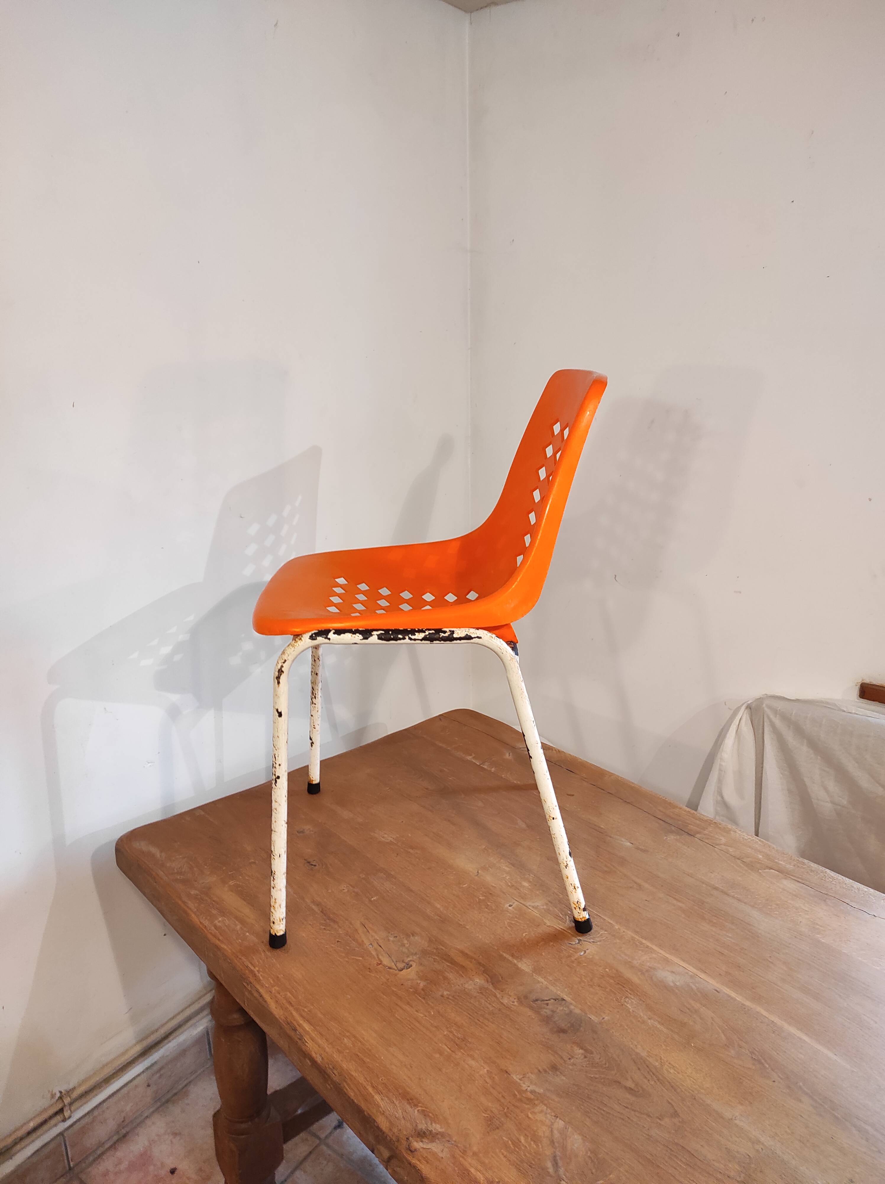 Chair with openwork plastic shell 1970