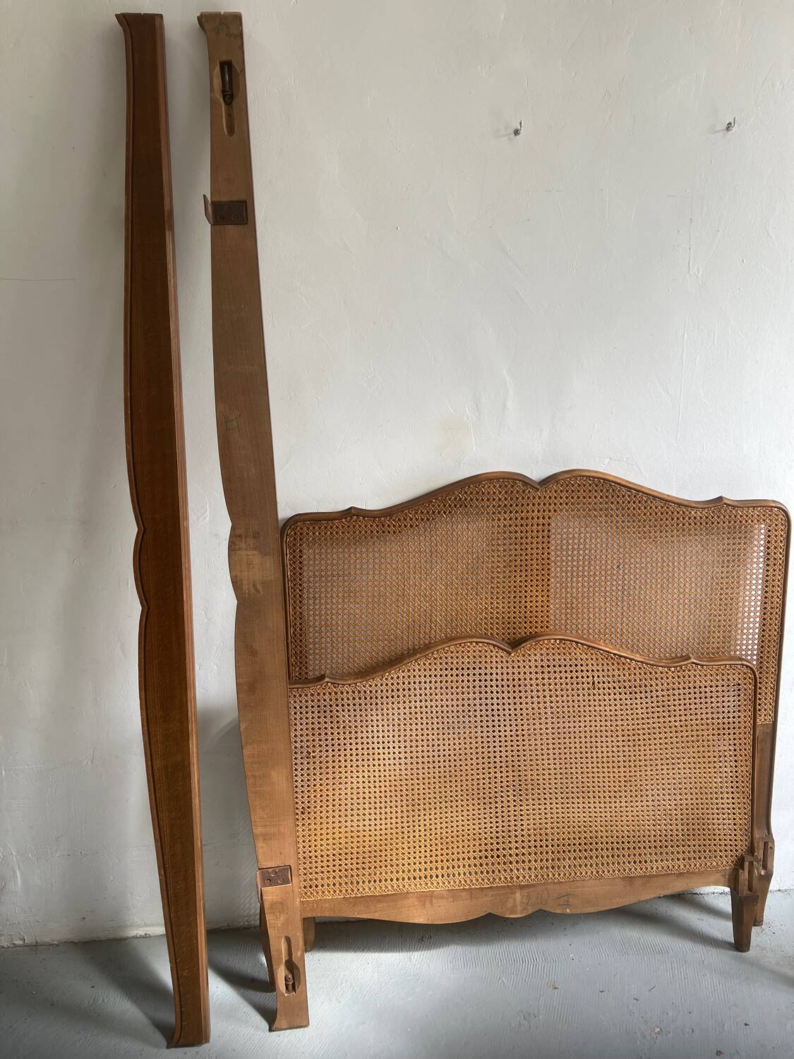 Old wooden and cane bed