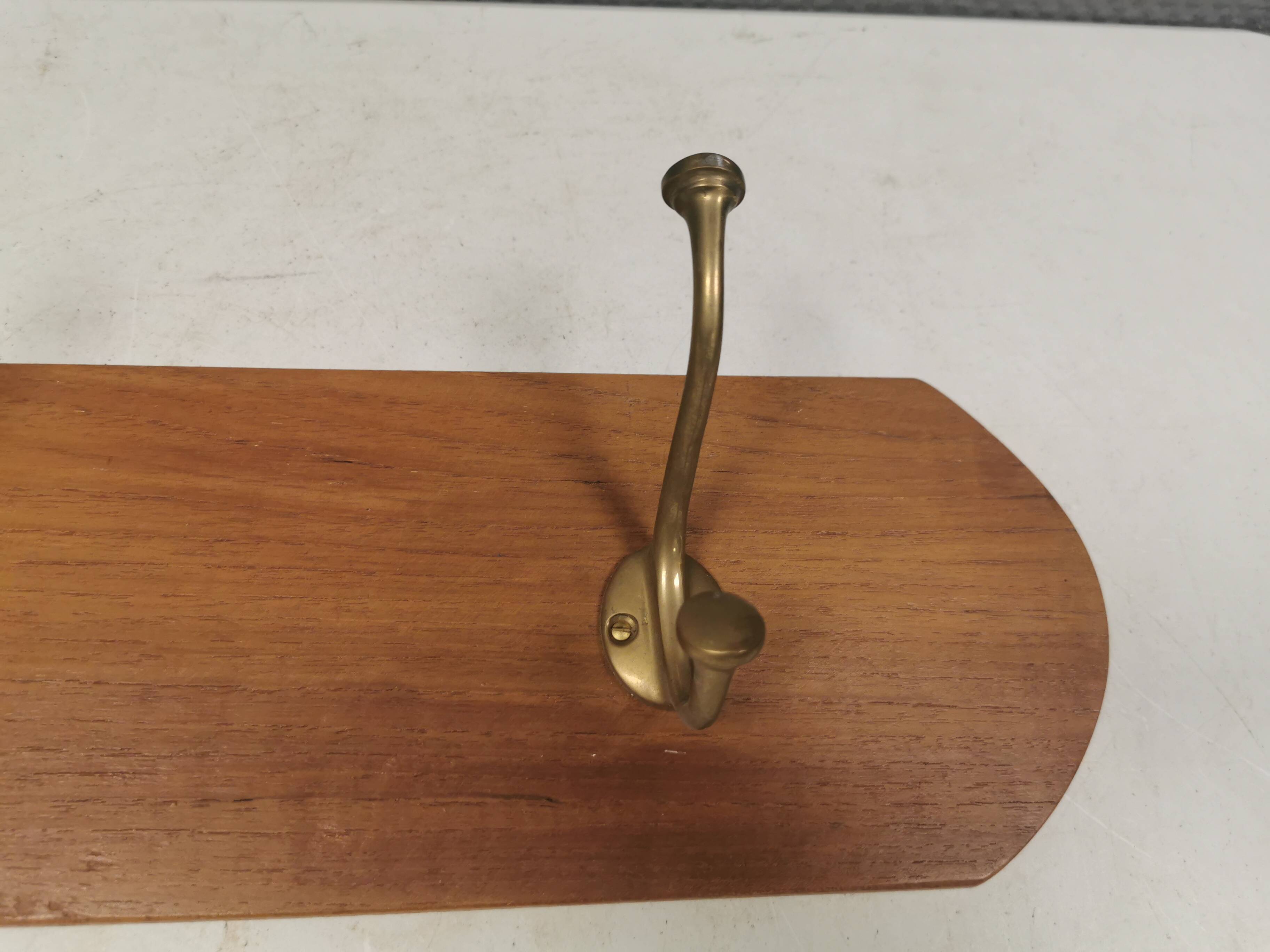 Coat rack in teak and brass. Denmark 1970-80s