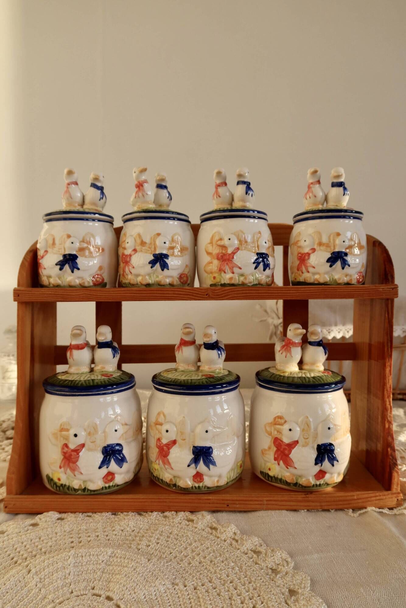 Vintage wooden wall condiment shelf and porcelain pots with geese slip pattern
