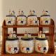 Vintage wooden wall condiment shelf and porcelain pots with geese slip pattern