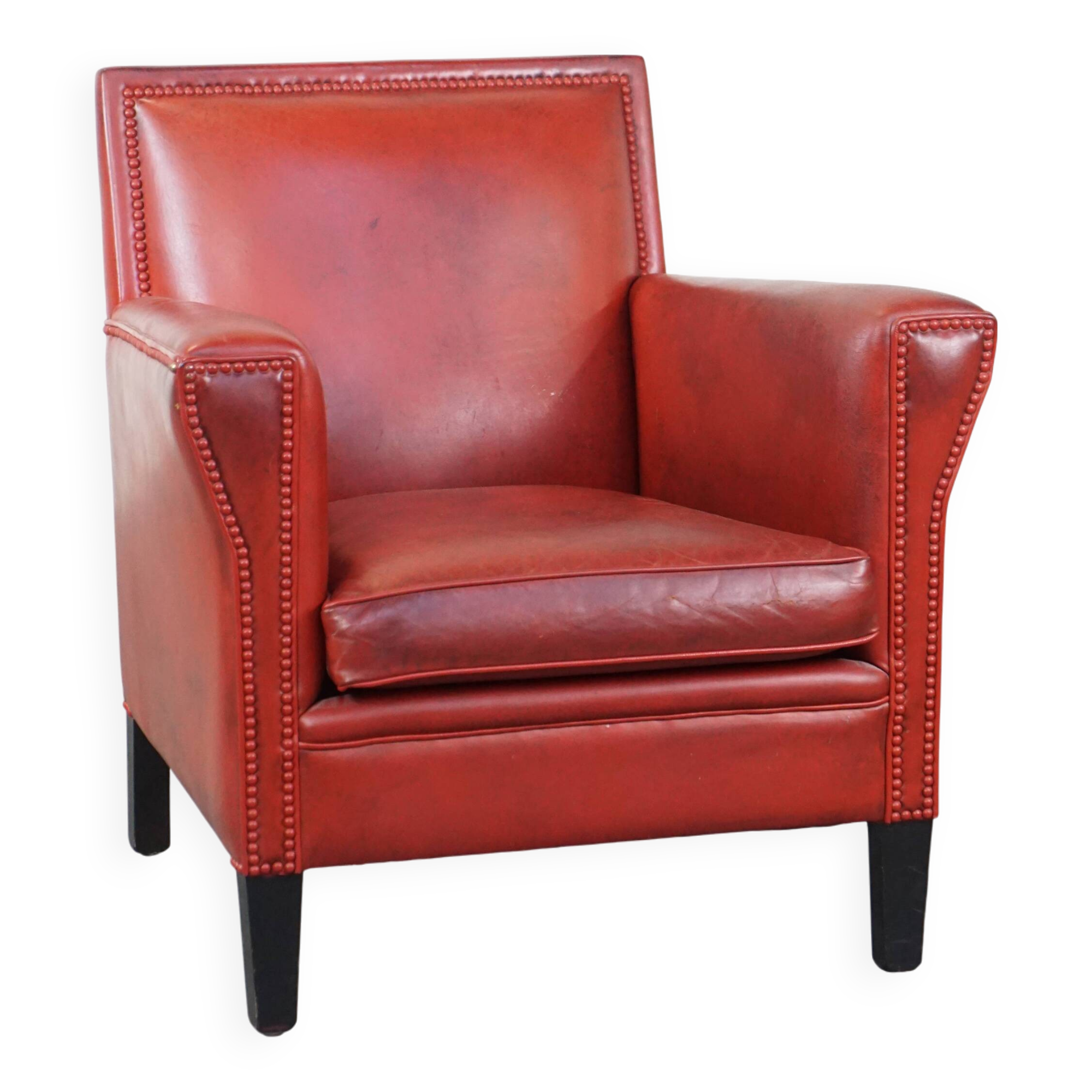 Red-painted armchair made of sheepskin leather