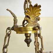 Antique gilded bronze chandelier with six arms, in Empire style.