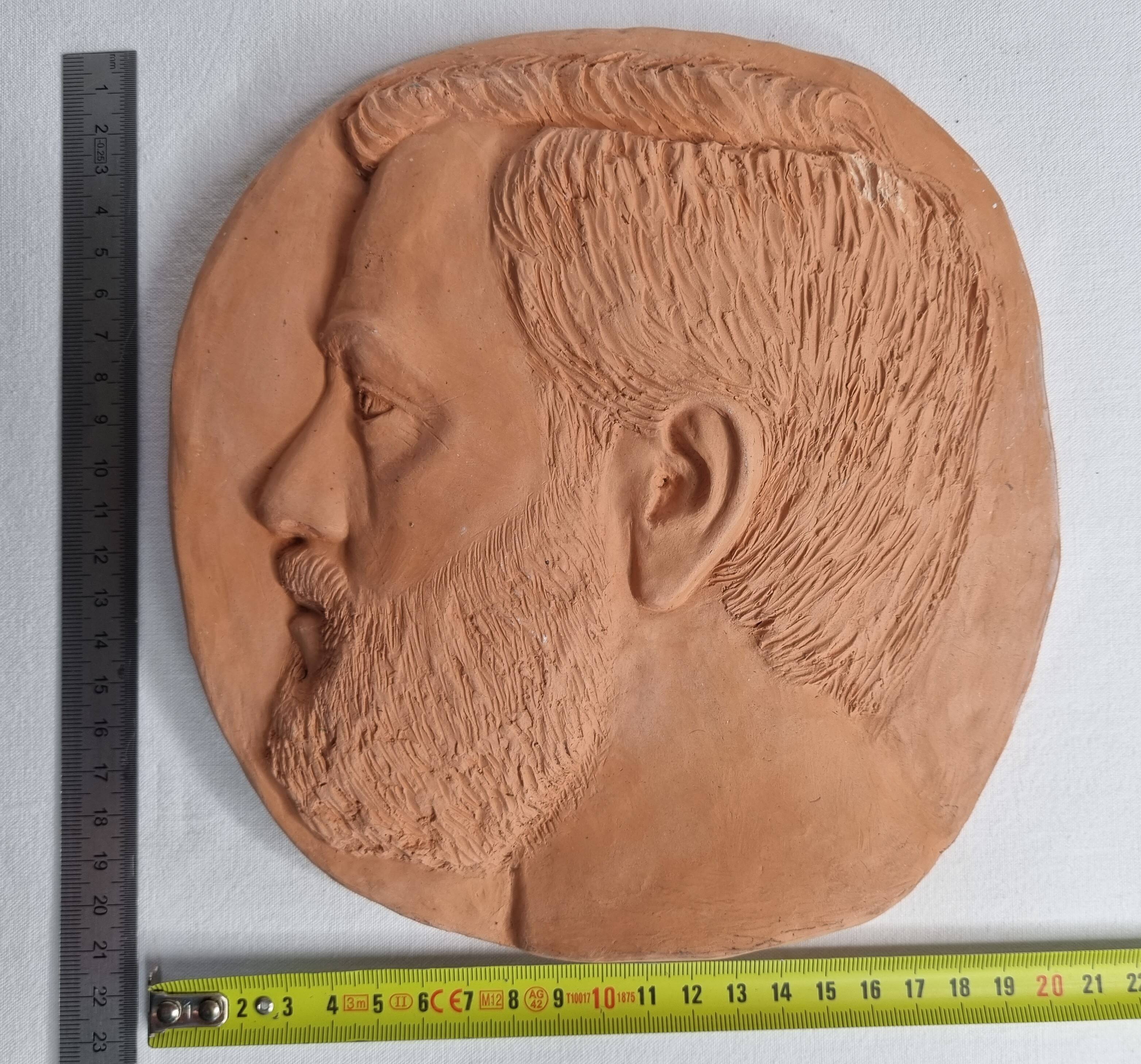 Bas-relief mural in terracotta, profile of a man, signed, 21 x 20 cm, 1984.