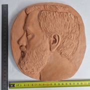 Bas-relief mural in terracotta, profile of a man, signed, 21 x 20 cm, 1984.