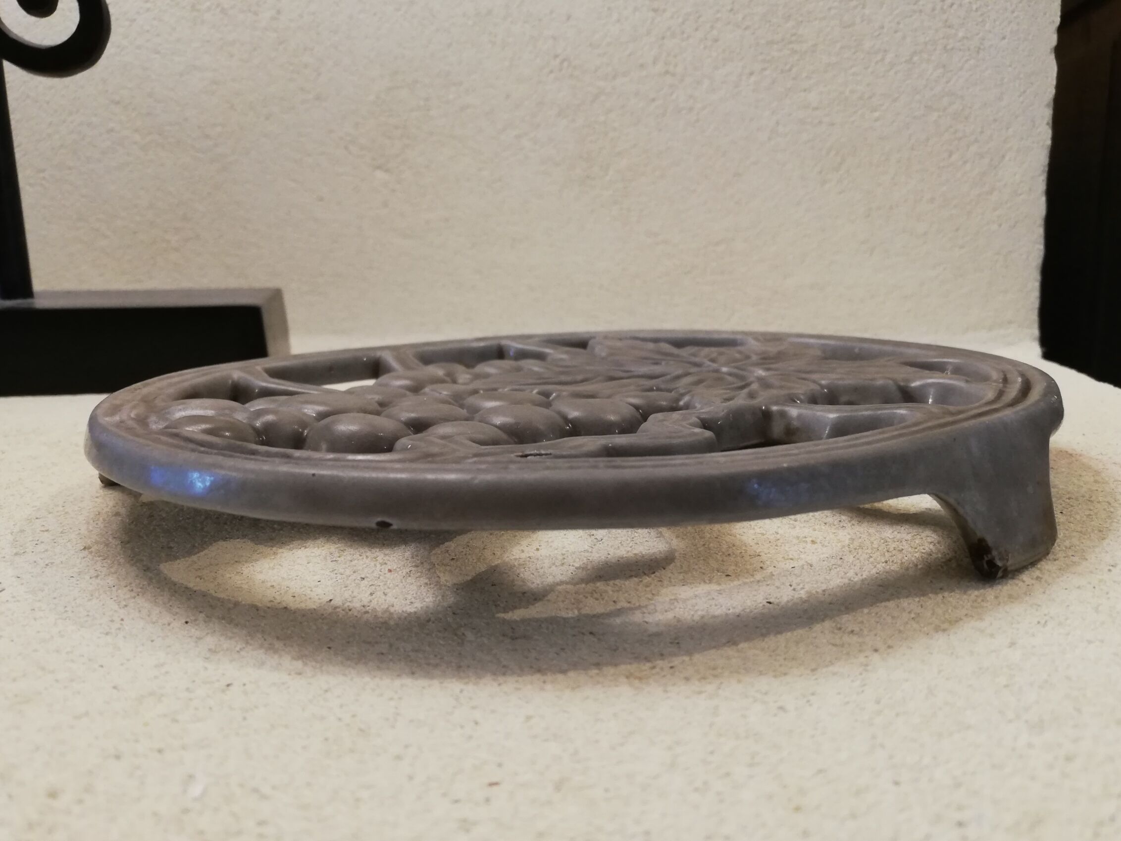 Cast iron underside bunch of grapes