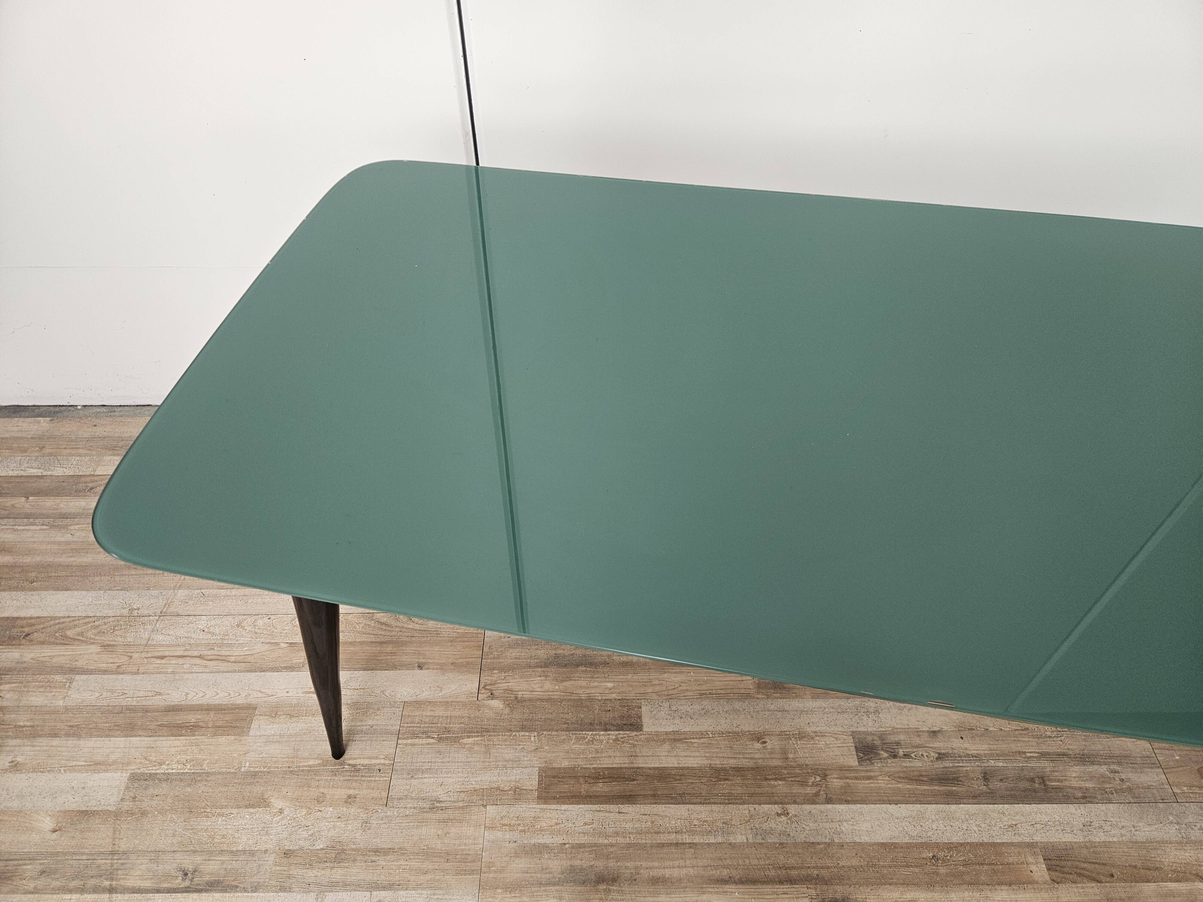 Mid-century mahogany dining table with aquamarine glass top