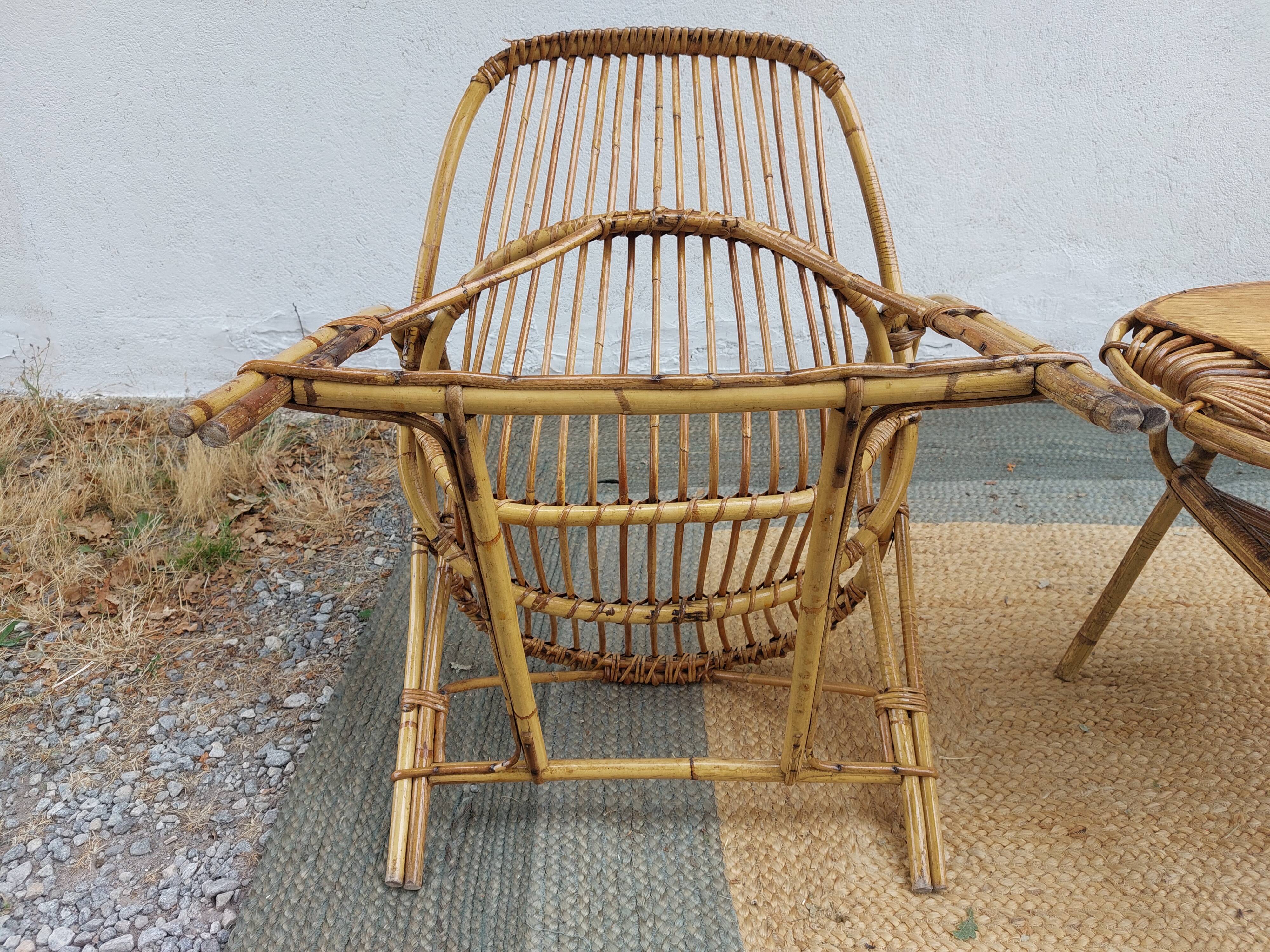 4 armchairs and a coffee table made of rattan and bamboo wood, vintage.